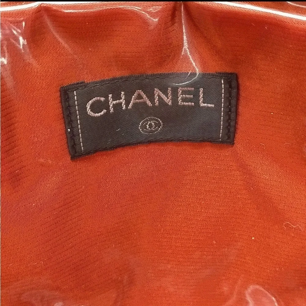 CHANEL Cream and Black Travel Bag with Elegant Design